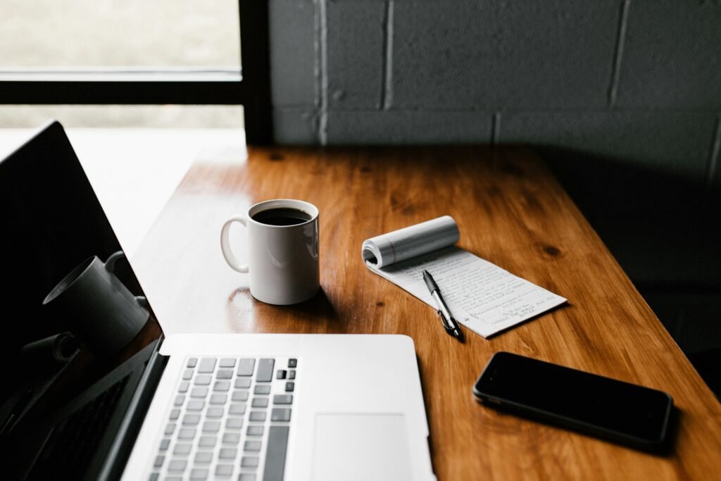 Career coaching workspace with laptop and notes